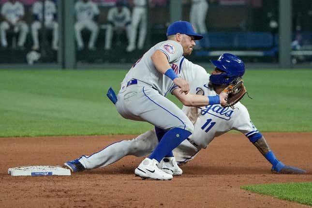Aug 1, 2023; Kansas City, Missouri, USA; New York Mets second baseman Danny Mendick (15) attempts to make the tag as Kansas City Royals third baseman Maikel Garcia (11) steals second base in the seventh inning at Kauffman Stadium.