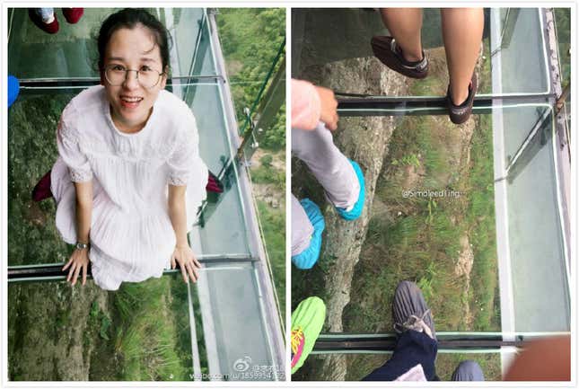People taking pictures on a glass bridge.