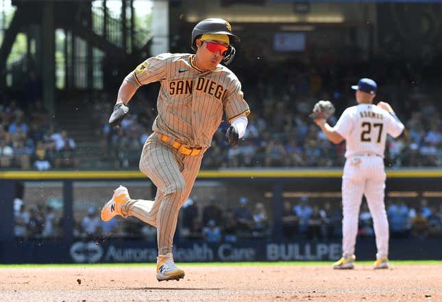 Aug 27, 2023; Milwaukee, Wisconsin, USA; San Diego Padres second baseman Ha-Seong Kim (7) runs from first to third base against the Milwaukee Brewers in the first inning at American Family Field.