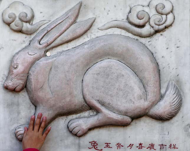 In Chinese folklore, an empress named Chang’e swallows a pill that gives her immortal life and thus prevents her selfish, greedy husband from staying in power. Chang’e flies to the moon with her pet rabbit, where she lives forever as the moon goddess. The message below this relief of a rabbit on a temple in Beijing says “Holy rabbit flying to the moon, symbolizes luck and happiness”.
