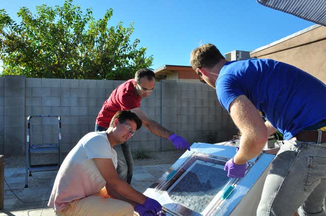 University of California Berkeley researchers Eugene Kapustin, Farhad Fathieh and Markus Kalmutzki set up a prototype of a water harvester.