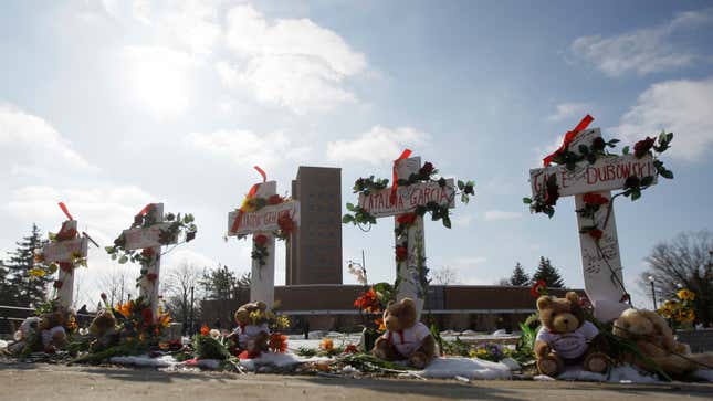 In this Feb. 14, 2009 file photo, Five crosses stand outside Northern Illinois University’s Cole Hall marking the one year anniversary of a shooting in the NIU lecture hall that left five students dead in DeKalb, Ill.