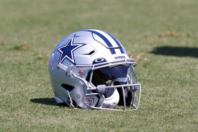 Aug 17, 2022; Costa Mesa, CA, USA; A Dallas Cowboys helmet with Oakley visor sits on the field during joint practice against the Los Angeles Chargers at Jack Hammett Sports Complex.