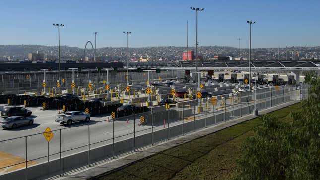 Vehicles enter a border checkpoint as they approach the Mexico border at the US Customs and Border Protection (CBP) San Ysidro Port of Entry at the US Mexico border on February 19, 2021 in San Diego, California. 