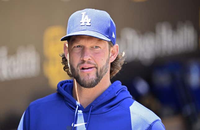 Aug 7, 2023; San Diego, California, USA; Los Angeles Dodgers pitcher Clayton Kershaw (22) looks on from the dugout before the game against the San Diego Padres at Petco Park.