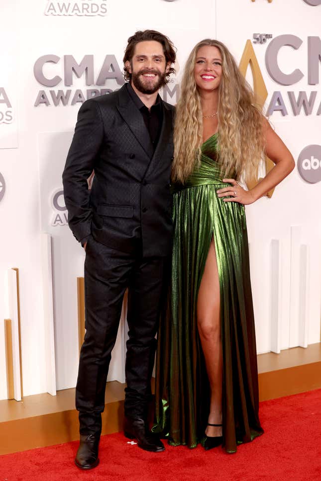 Image for article titled 2022 CMAs Red Carpet: Katy Perry Wears Stupid Denim Jumpsuit With Giant Bow, Etc.