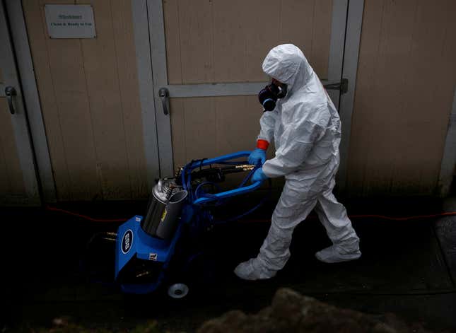 A Servpro worker wheels in an electrostatic sprayer at Life Care Center of Kirkland, a long-term care facility linked to several confirmed coronavirus cases, in Kirkland, Washington, U.S. March 13, 2020.