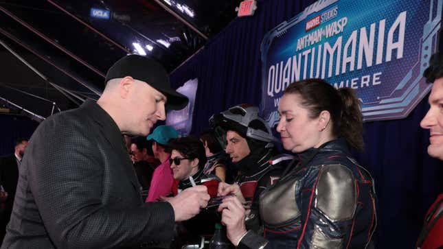 Kevin Feige signing autographs at the Ant-Man 3 premiere.