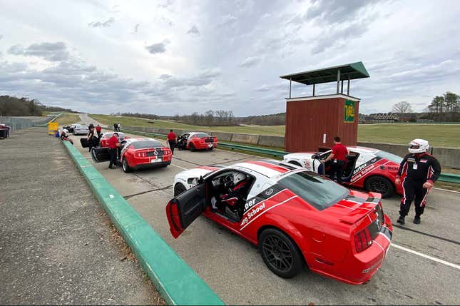 A view of cars lined up in the pit lane at Skip Barber Racing School.