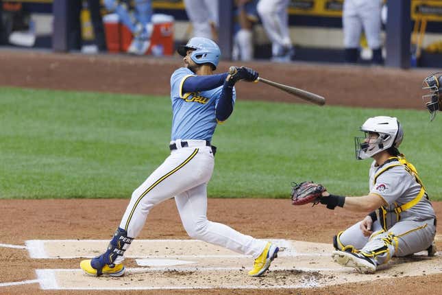 Jun 16, 2023; Milwaukee, Wisconsin, USA;  Milwaukee Brewers right fielder Blake Perkins (16) hits an RBI single during the first inning against the Pittsburgh Pirates at American Family Field.