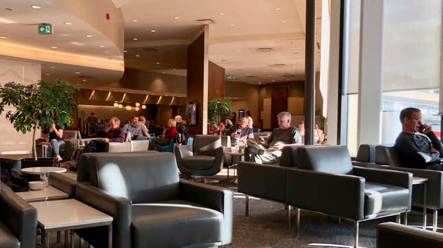 people sitting in an airport lounge