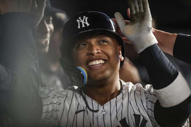 Jun 10, 2023; Bronx, New York, USA; New York Yankees right fielder Willie Calhoun (24) celebrates with teammates after hitting a solo home run in the sixth inning against the Boston Red Sox at Yankee Stadium.