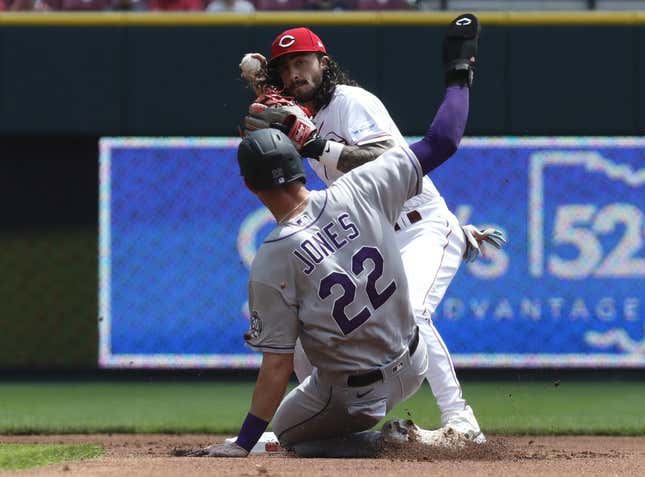 Jun 21, 2023; Cincinnati, Ohio, USA; Colorado Rockies first baseman Nolan Jones (22) is forced out at second against Cincinnati Reds second baseman Jonathan India (6) during the first inning at Great American Ball Park.