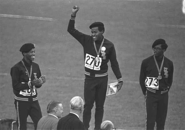 United States runners Larry James, left, Lee Evans, center, and Ron Freeman are shown after receiving their medals for the 400-meter race at the Mexico City Games in Mexico City, in this Oct. 18, 1968, file photo. 