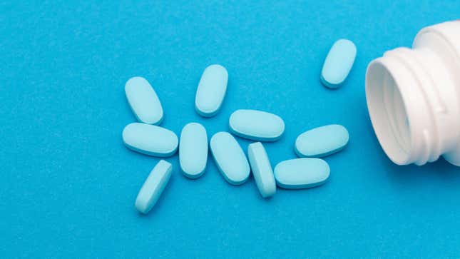 Blue Viagra pills on blue background
