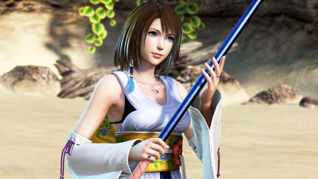 Yuna is seen holding her staff on a beach.