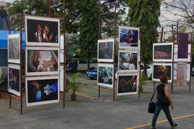 Some of Brother Jun’s photos of extra-judicial killings are included in this roving exhibit in the parking lot of a parish in Manila.