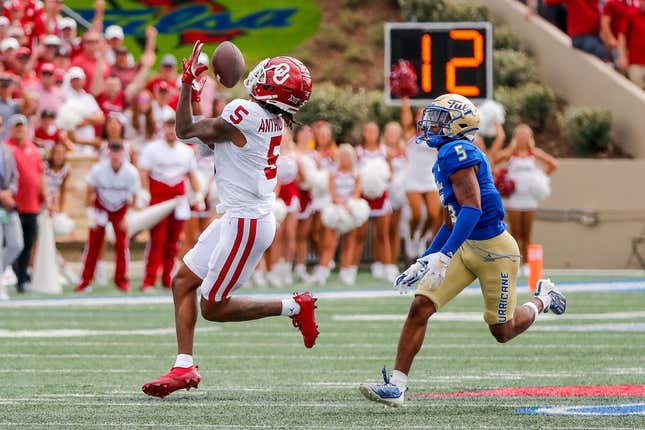 Sep 16, 2023; Tulsa, Oklahoma, USA; Oklahoma&#39;s Andrel Anthony (5) catches a pass for a first down in the first quarter against the Tulsa Golden Hurricane at Skelly Field at H.A. Chapman Stadium.