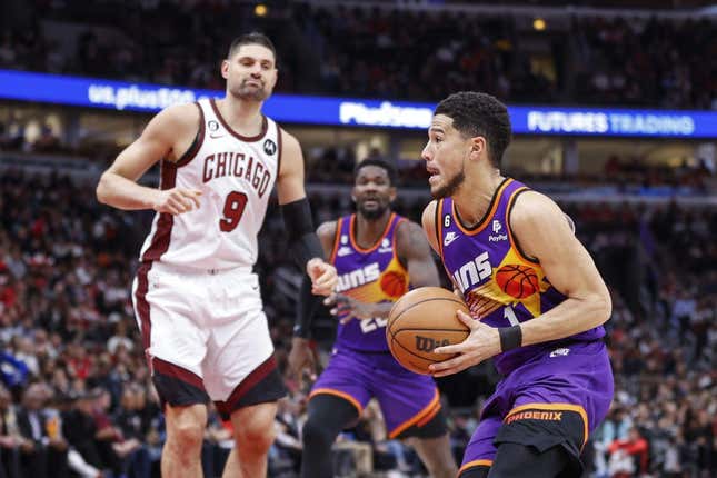 Mar 3, 2023; Chicago, Illinois, USA; Phoenix Suns guard Devin Booker (1) drives to the basket against the Chicago Bulls during the first half at United Center.