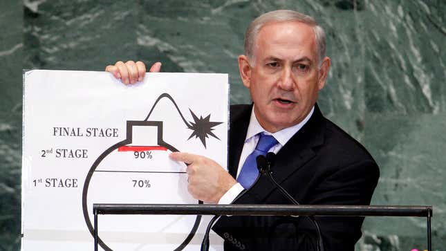 Israel's Prime Minister Benjamin Netanyahu points to a red line he has drawn on the graphic of a bomb as he addresses the 67th United Nations General Assembly at the U.N. Headquarters in New York, September 27, 2012.