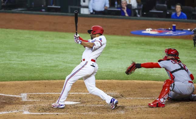 Jun 6, 2023; Arlington, Texas, USA; Texas Rangers second baseman Marcus Semien (2) hits a two-run double during the fourth inning against the St. Louis Cardinals at Globe Life Field.