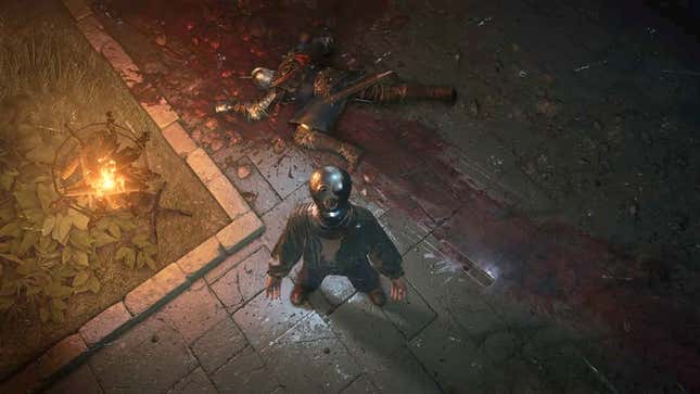 An Elden Ring prisoner is looking up at the camera, with a bloodied corpse laid out behind them.
