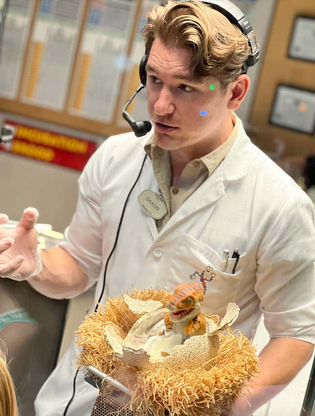 baby raptor and a scientist 