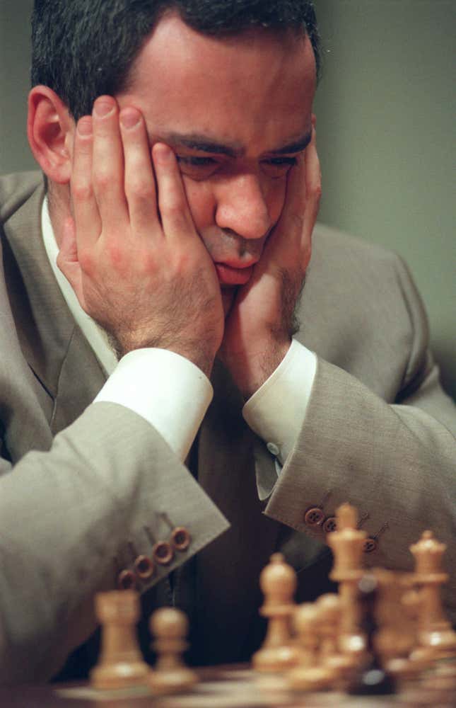 Kasparov considers a chess board.