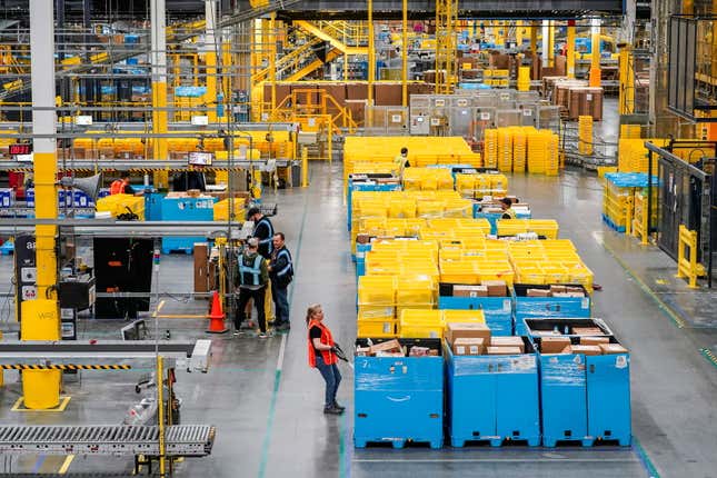 Amazon workers in fulfillment center.