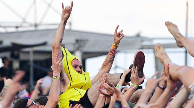 We couldn’t find a photo of a snake at a festival, so here’s a concertgoer dressed as “the snake of fruit:” a banana.