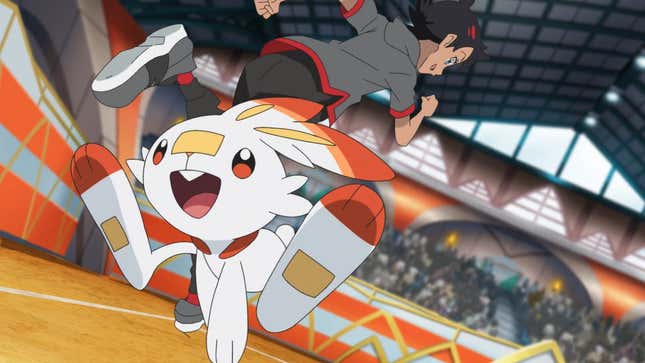 Scorbunny and Goh are seen walking through a stadium.