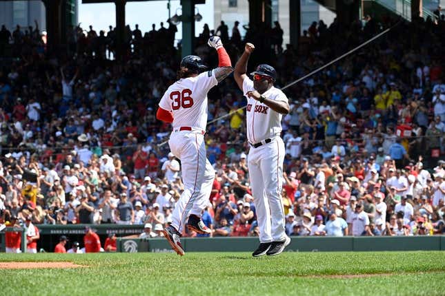 Aug 6, 2023; Boston, Massachusetts, USA; Boston Red Sox first baseman Triston Casas (36) celebrates his home run against the Toronto Blue Jays with third base coach Carlos Febles (53) during the fourth inning at Fenway Park.