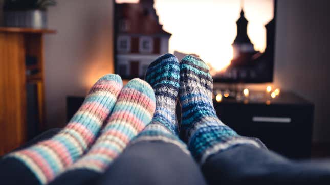 Couple wearing socks, watching TV