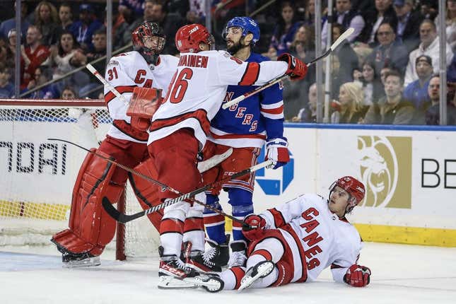 Mar 21, 2023; New York, New York, USA;  Carolina Hurricanes left wing Teuvo Teravainen (86) and New York Rangers center Vincent Trocheck (16) shove each other in the third period at Madison Square Garden.