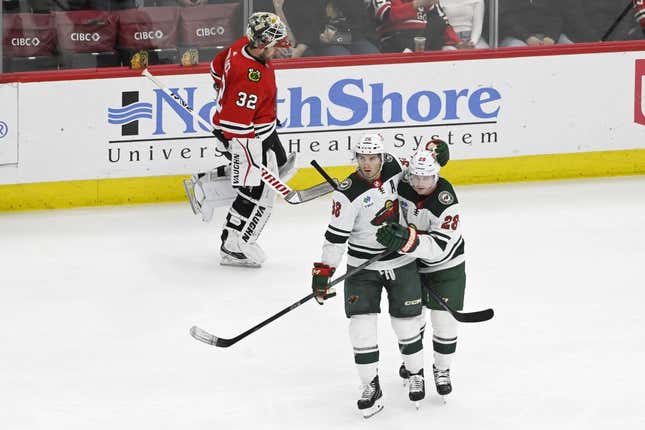 Apr 10, 2023; Chicago, Illinois, USA;  Minnesota Wild right wing Ryan Hartman (38) celebrates with Minnesota Wild center Gustav Nyquist (28) after Nyquist scored a goal against the Chicago Blackhawks during the third period at the United Center.
