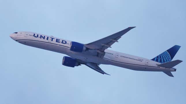 A Boeing 777-300ER of the U.S. airline United Airlines flies over F'rth after takeoff at Nuremberg Airport.