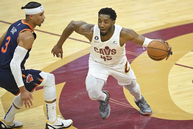 Apr 15, 2023; Cleveland, Ohio, USA; Cleveland Cavaliers guard Donovan Mitchell (45) dribbles beside New York Knicks guard Josh Hart (3) in the second quarter of game one of the 2023 NBA playoffs at Rocket Mortgage FieldHouse.