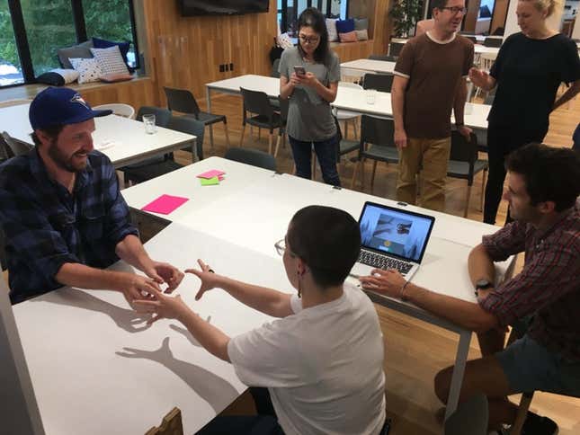 IDEO designers pair up to express ideas through gestures.