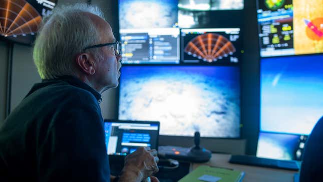 David Butterfield of the University of Washington looks at video feeds coming in from the ROV. 