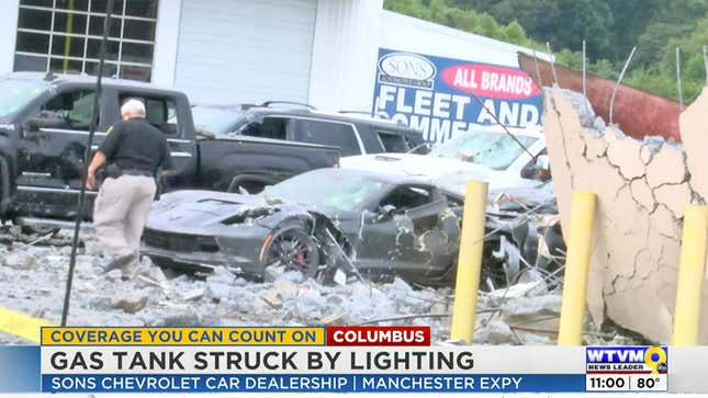A photo of destroyed cars on a dealer lot after a lightning strike. 