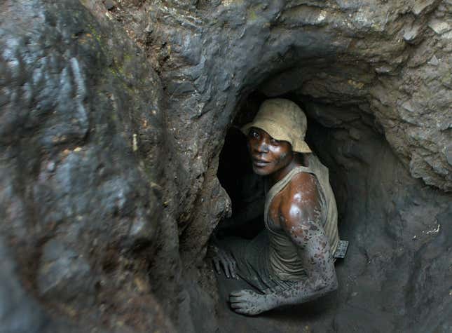 A man enters one of the tunnels dug with shovels in the Shinkolobwe mine 35km from the town of Likasi South Eastern, DR Congo,