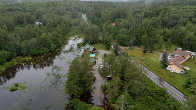 water covers residential property on Route 11 after heavy rain on July 10, 2023 in Londonderry, Vermont. Torrential rain and flooding has affected millions of people from Vermont south to North Carolina. 