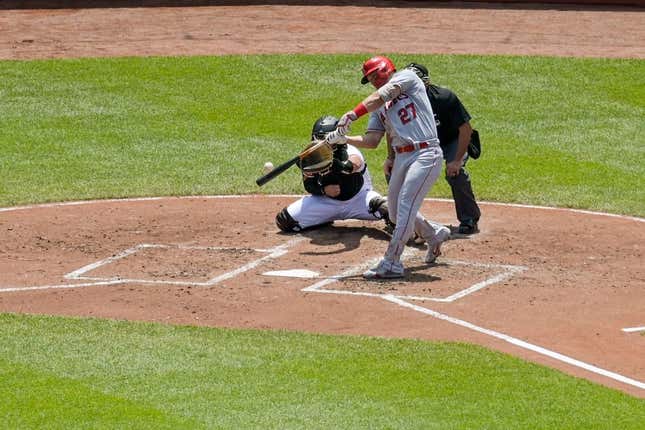 May 18, 2023; Baltimore, Maryland, USA;  Los Angeles Angels center fielder Mike Trout (27) hits a solo home run to center field during the third inning against the Baltimore Orioles at Oriole Park at Camden Yards.