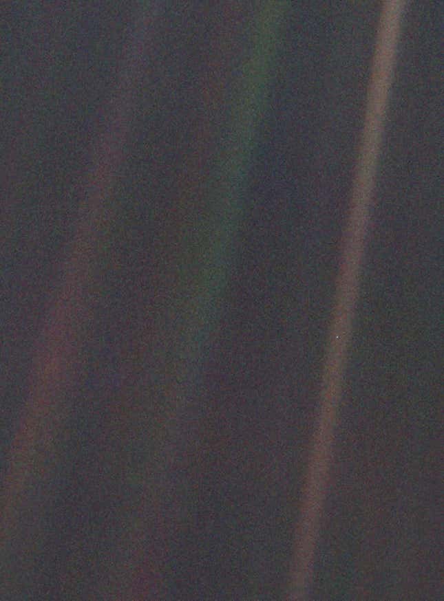 Earth from the edge of the solar system, visible as a minuscule pale blue dot in the center of the right-most brown stripe.NASA, Voyager 1