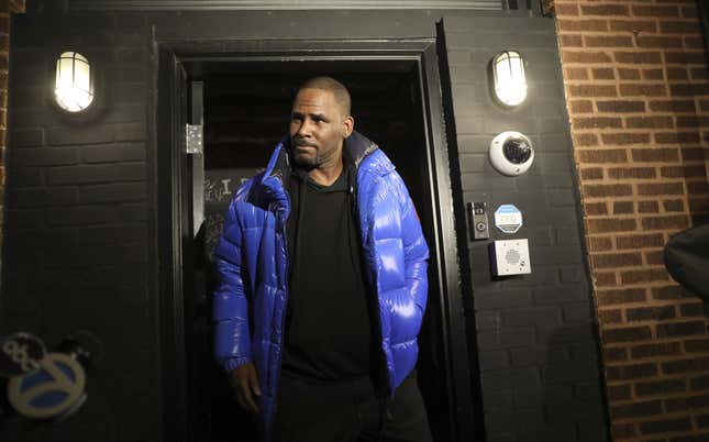 R. Kelly emerges from his Chicago studio to turn himself in to Chicago police on Feb. 22, 2019.