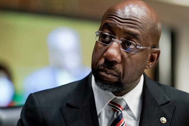 Senator Raphael Warnock (D-GA) listens to Dr. Philip Nathan Jefferson, of North Carolina, nominated to be a Member of the Board of Governors of the Federal Reserve System, during a Senate Banking, Housing, and Urban Affairs Committee confirmation hearing on Capitol Hill in Washington, DC on February 3, 2022