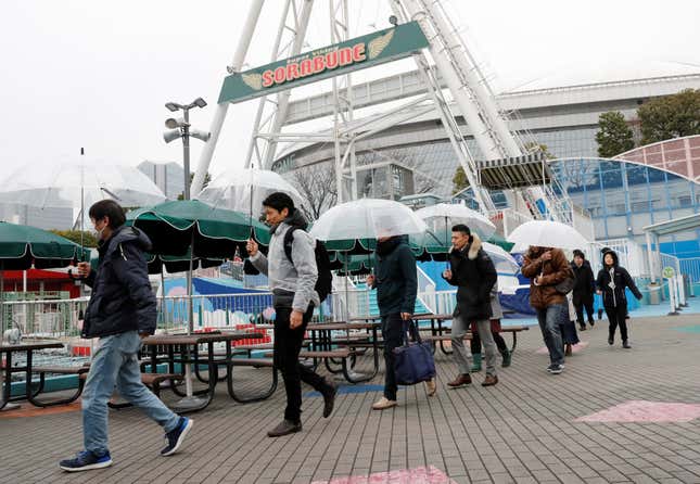 Participants make their way during an anti-missile evacuation drill in Tokyo.