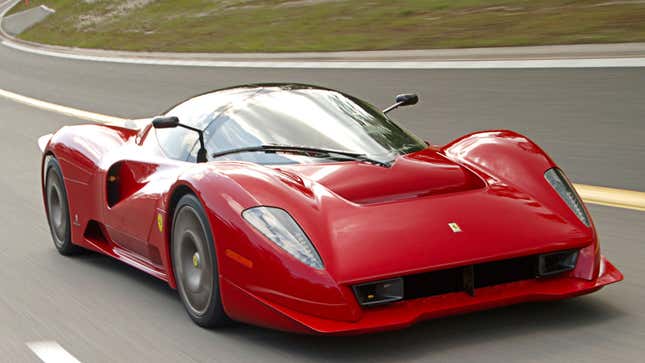 A photo of a red Ferrari P4/5 supercar on a highway. 