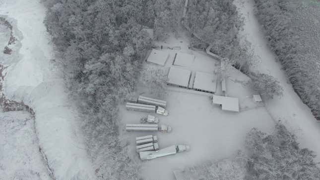 Trucks covered in volcanic ash in the aftermath of the eruption of the Fuego volcano.