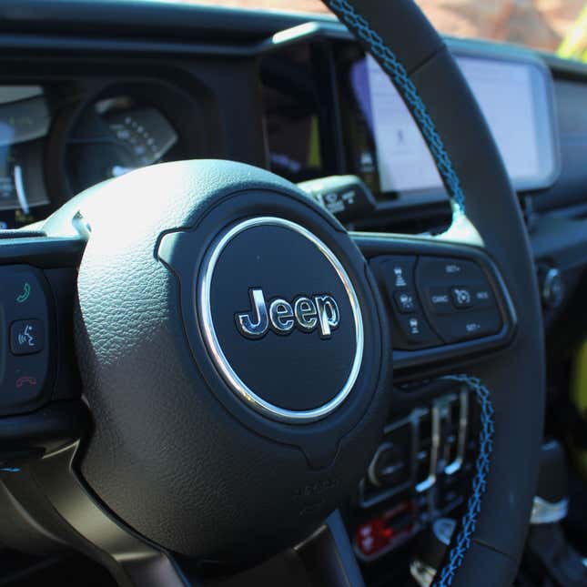A photo of the steering wheel on a Jeep Wrangler. 